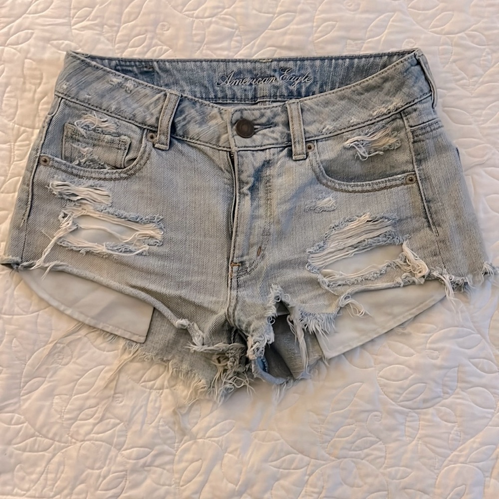 Distressed denim AE shorts.